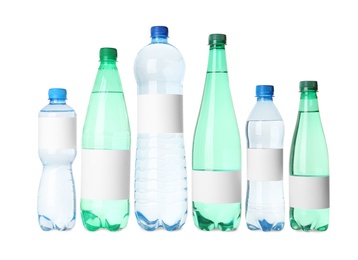 Bottles of pure water with blank labels on white background