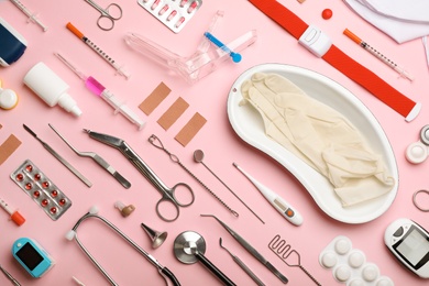 Photo of Flat lay composition with medical objects on color background