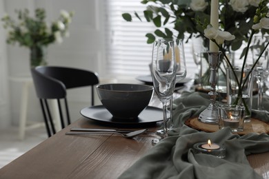 Festive table setting with beautiful tableware and decor indoors