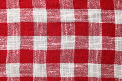 Red checkered tablecloth as background, top view