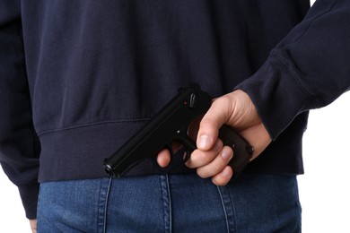 Photo of Man hiding gun behind his back, closeup view