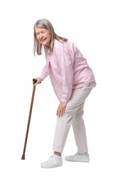 Photo of Senior woman with walking cane suffering from knee pain on white background