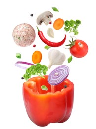 Image of Stuffed pepper recipe. Fresh ingredients falling into bell pepper on white background