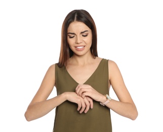 Young woman scratching hand on white background. Annoying itch