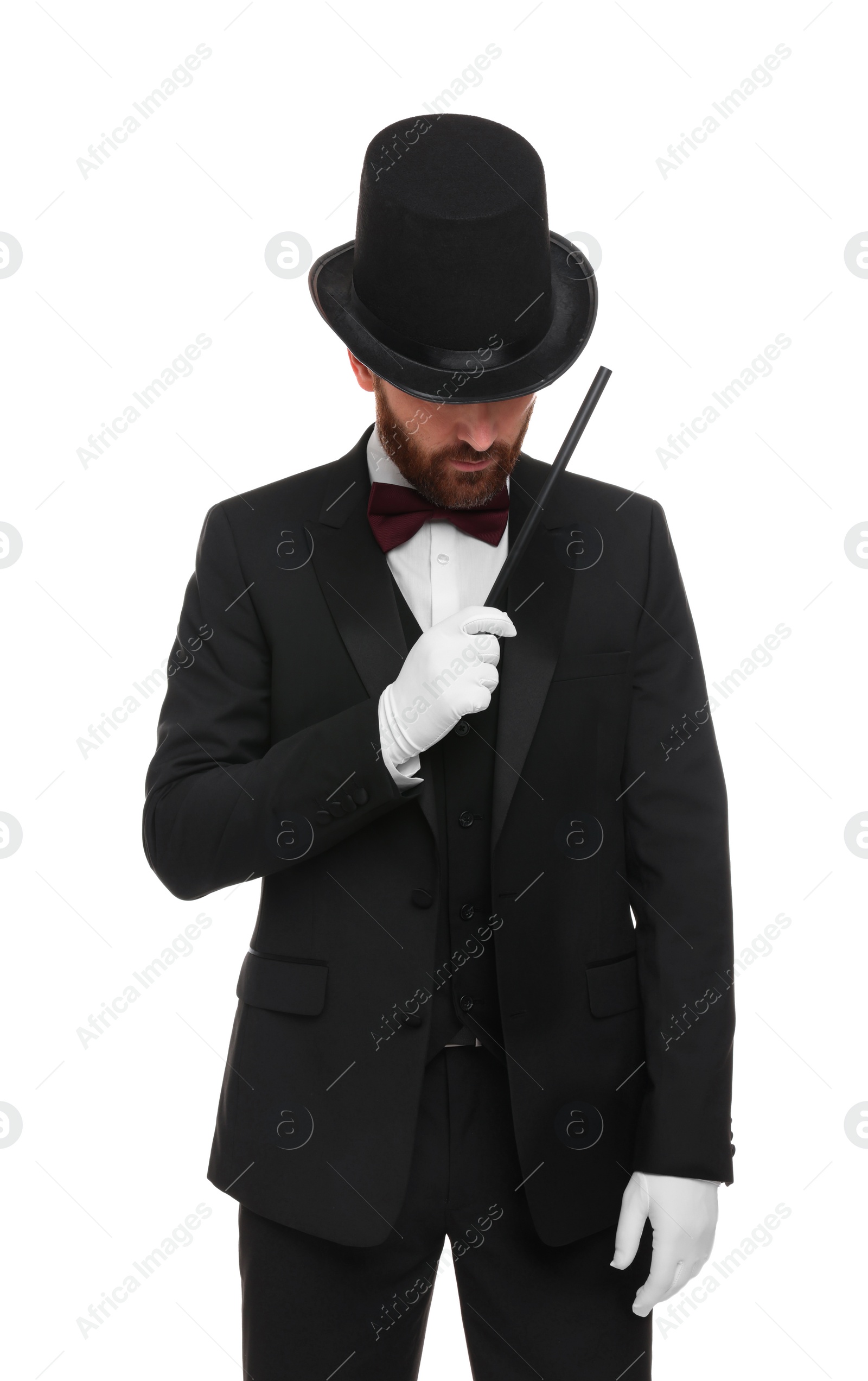 Photo of Magician in top hat holding wand on white background