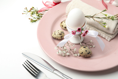 Festive Easter table setting with beautiful floral decor, closeup