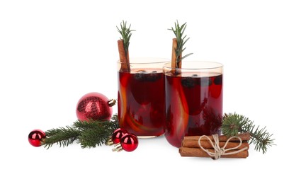 Aromatic Sangria drink in glasses and Christmas decor on white background