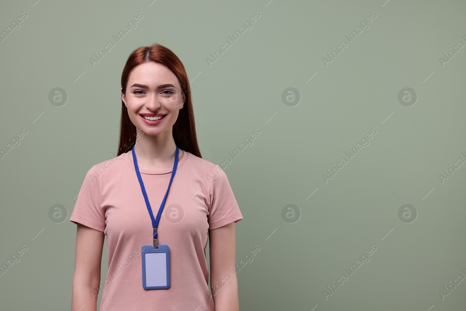 Photo of Smiling woman with vip pass badge on pale green background. Space for text