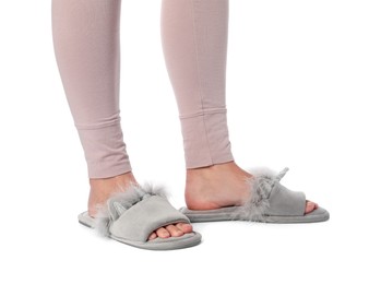 Woman in grey soft slippers on white background, closeup