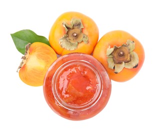 Jar of tasty persimmon jam with fresh fruits on white background, top view