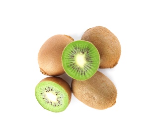 Cut and whole fresh kiwis on white background, top view