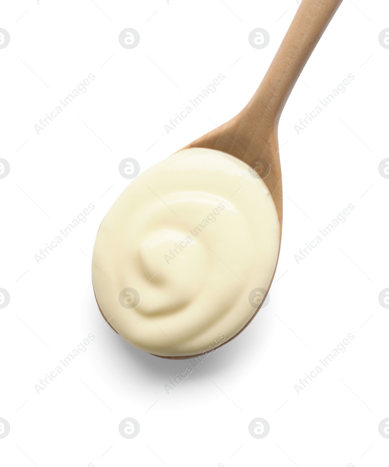 Photo of Natural yogurt in wooden spoon isolated on white, top view