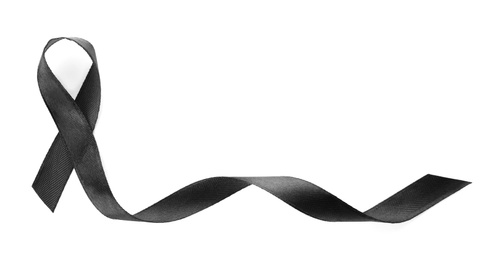 Photo of Black ribbon on white background, top view. Funeral symbol