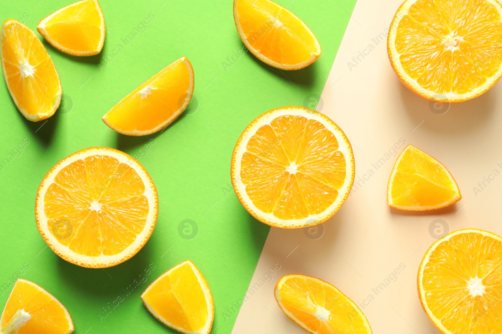 Photo of Flat lay composition with ripe oranges on color background