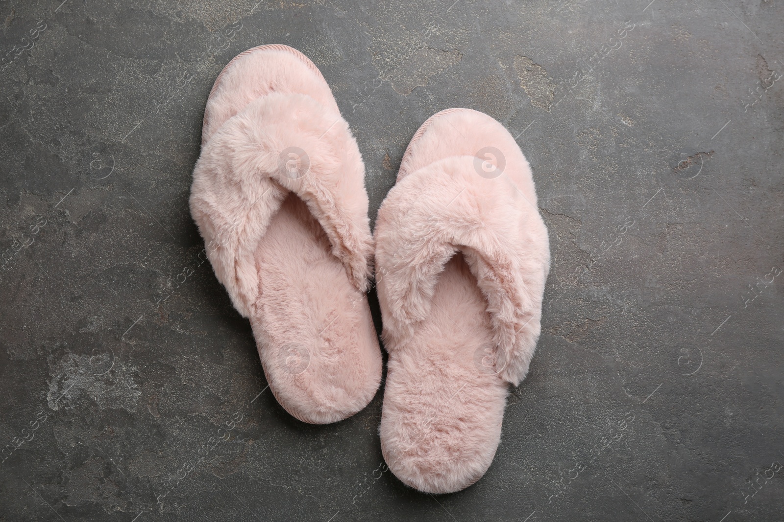 Photo of Pair of stylish soft slippers on grey background, flat lay