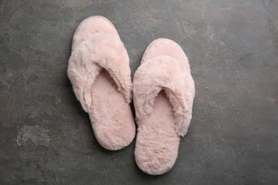 Pair of stylish soft slippers on grey background, flat lay