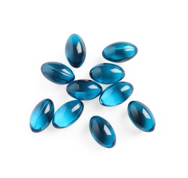 Photo of Many light blue pills isolated on white, top view