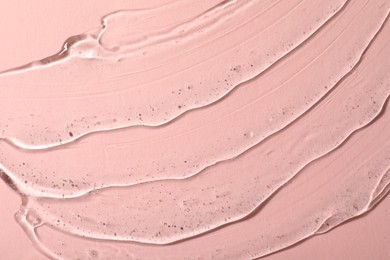 Cosmetic gel on pink background, top view