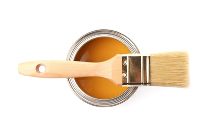 Paint can with brush on white background, top view