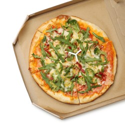 Photo of Delicious vegetarian pizza in cardboard box isolated on white, top view