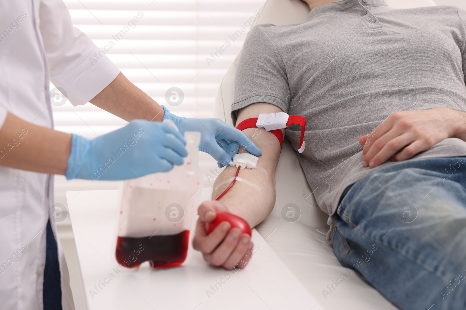 Photo of Patient undergoing blood transfusion in hospital, closeup