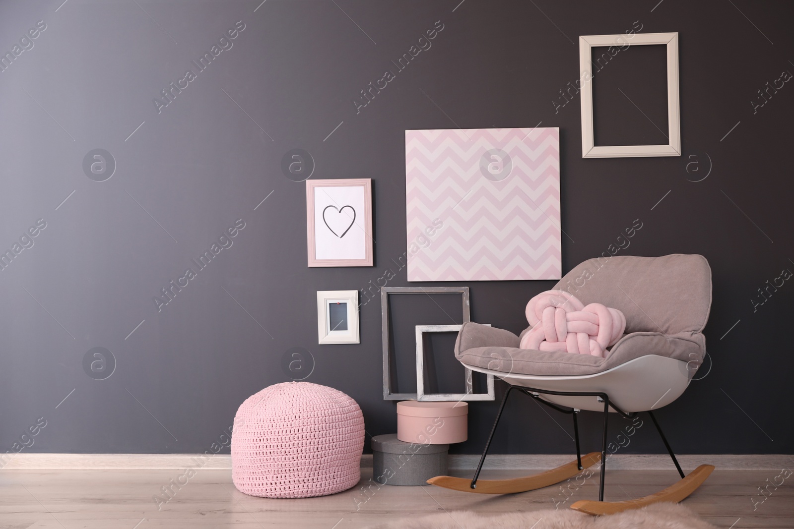 Photo of Unusual pillow on rocking chair in living room interior with space for design