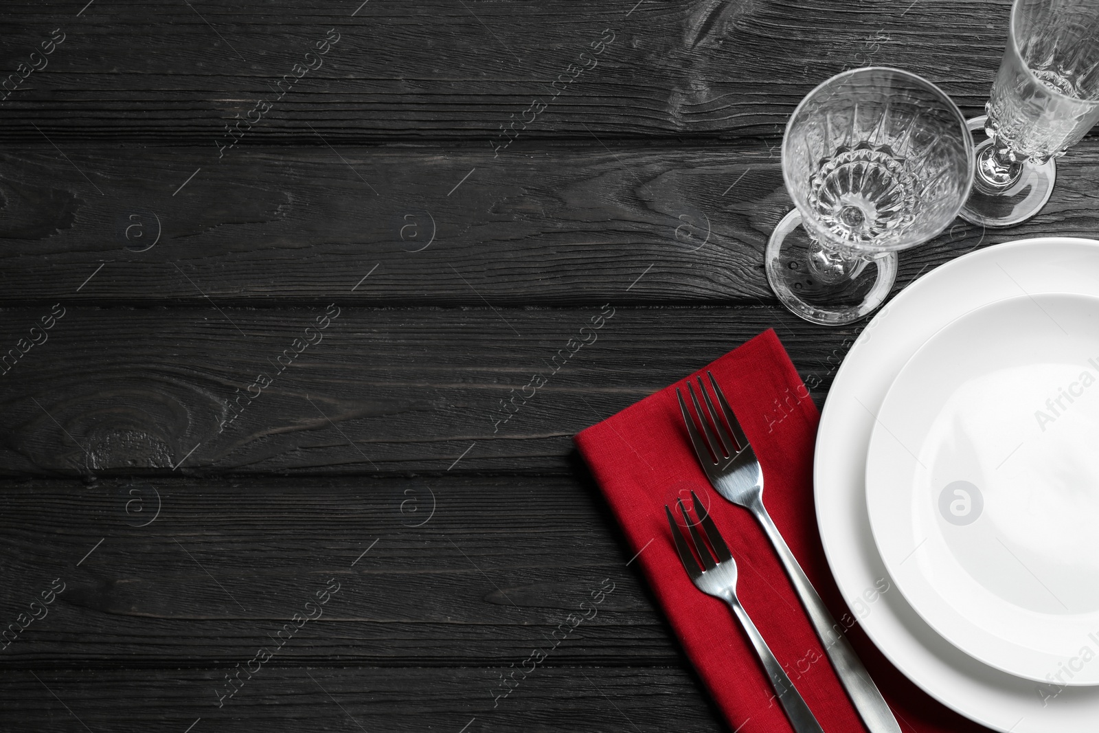 Photo of Elegant table setting on black wooden background, flat lay