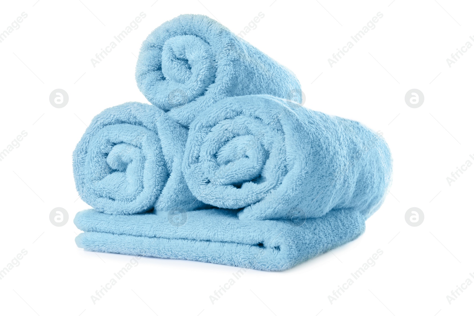 Photo of Soft clean turquoise towels on white background