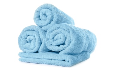Soft clean turquoise towels on white background