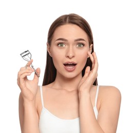 Photo of Emotional woman with eyelash curler on white background