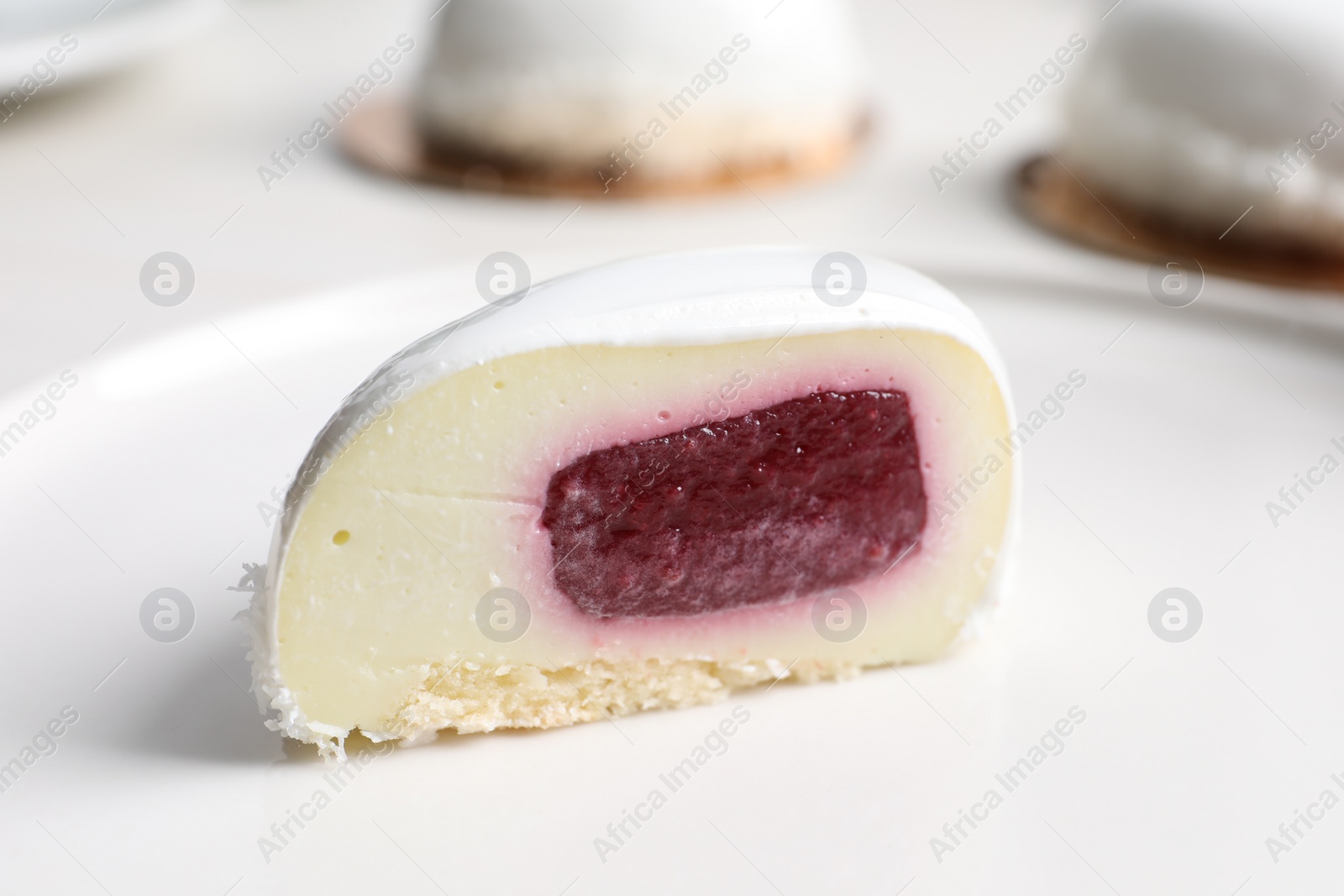 Photo of St. Valentine's Day. Piece of delicious cake served on plate, closeup