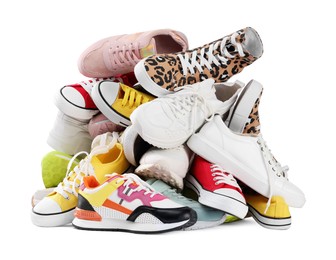 Pile of different female sneakers isolated on white