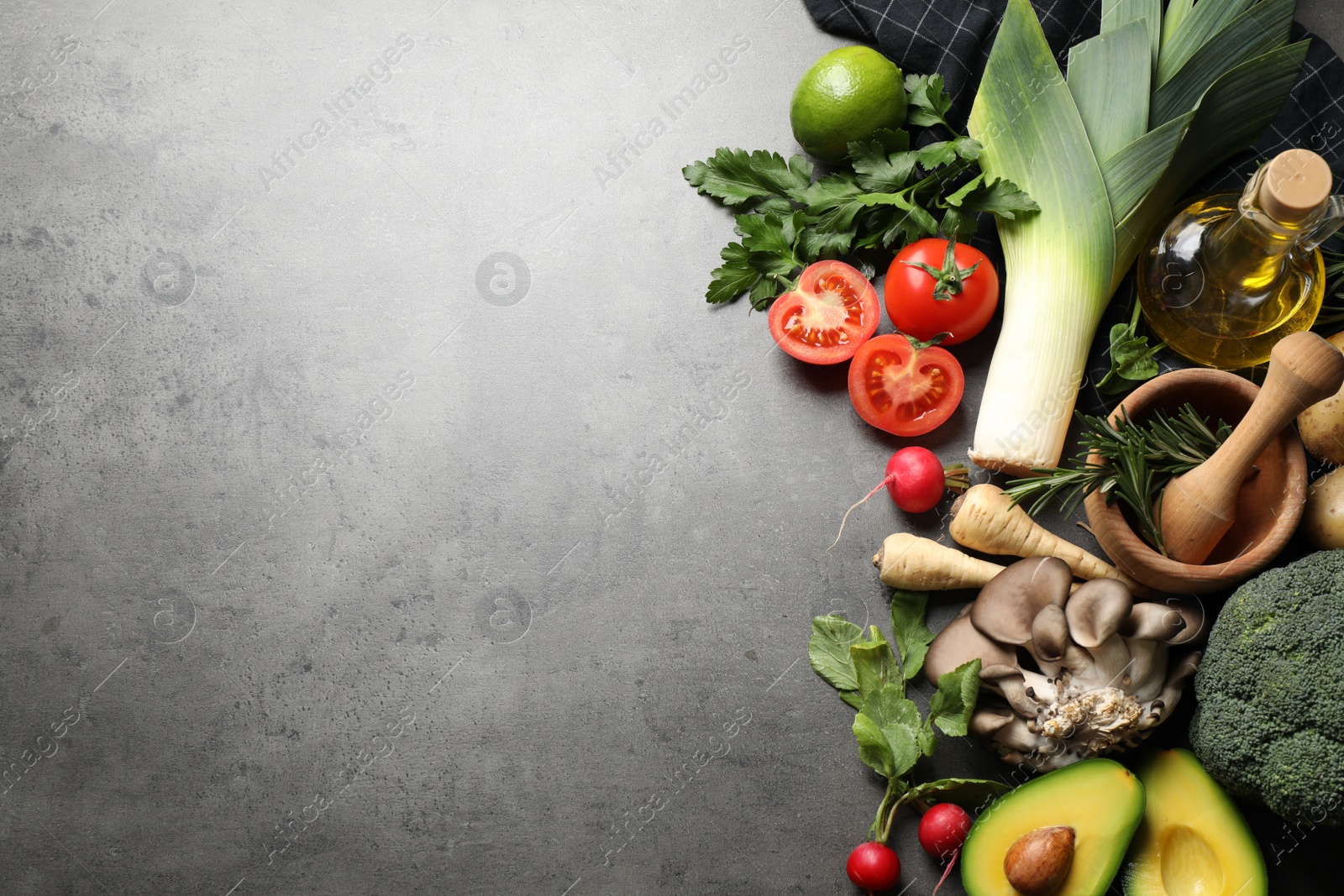 Photo of Flat lay composition with fresh products on grey table, space for text. Healthy cooking