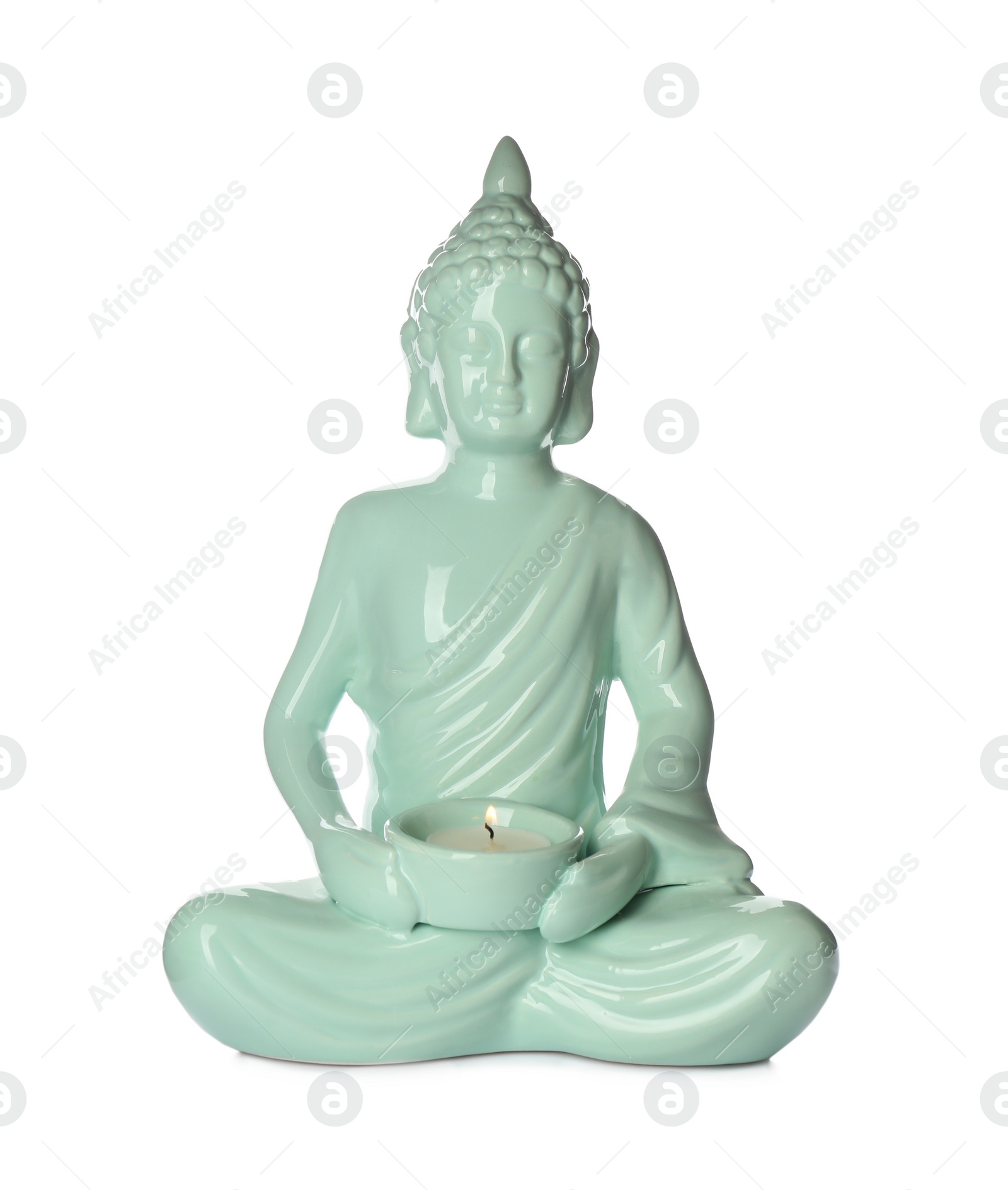 Photo of Beautiful ceramic Buddha sculpture with burning candle isolated on white