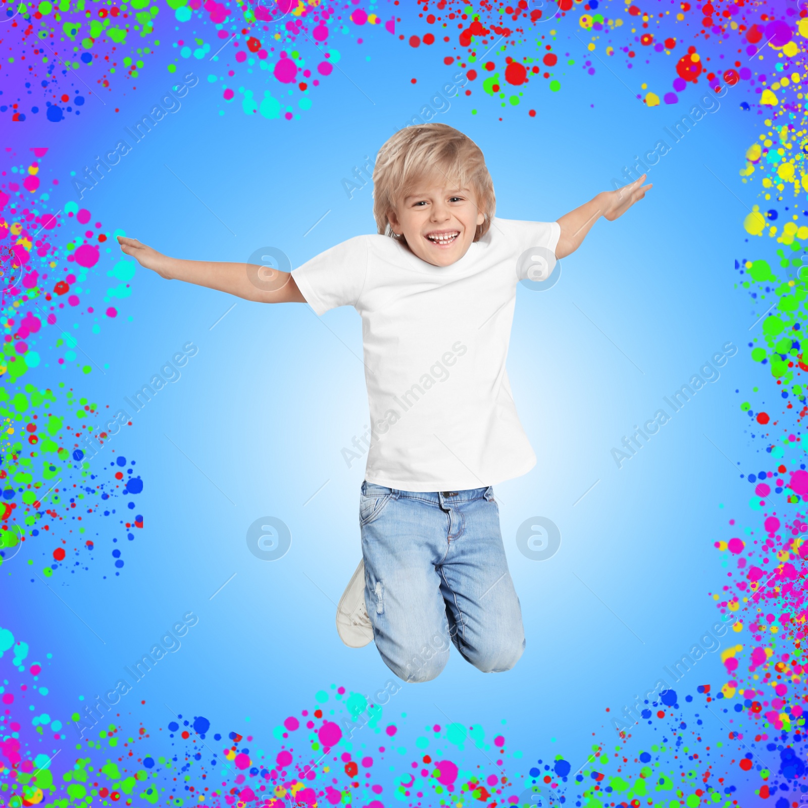 Image of Happy little boy jumping on colorful background. School holidays