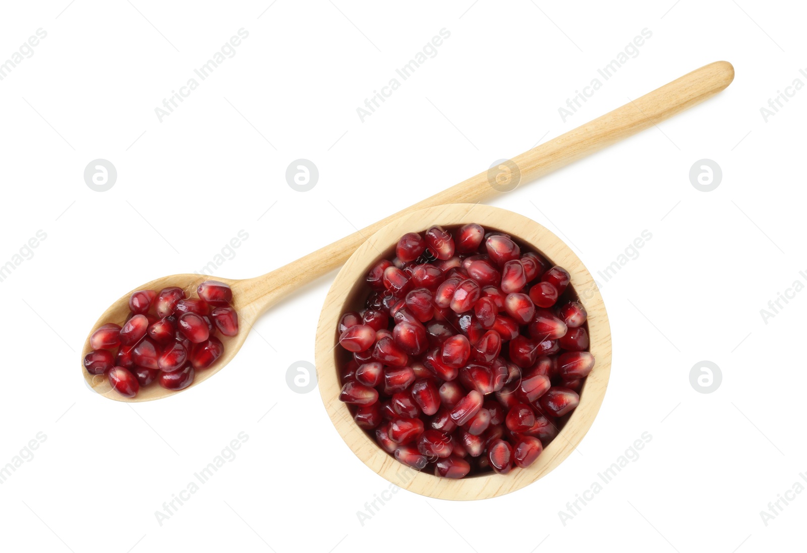 Photo of Ripe juicy pomegranate grains in bowl and wooden spoon isolated on white, top view