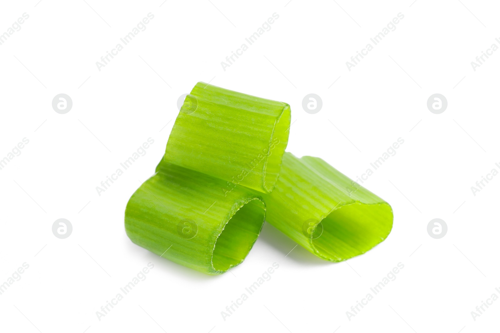 Photo of Pieces of fresh green onion on white background