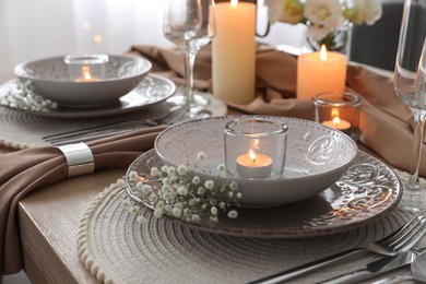 Photo of Festive table setting with beautiful floral decor in restaurant