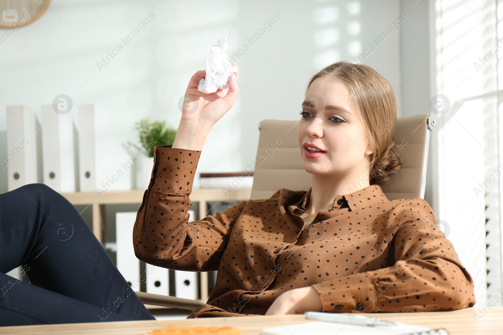 Photo of Lazy worker at wooden desk in office