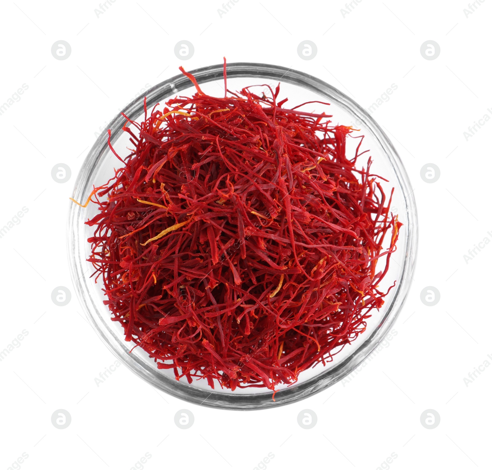 Photo of Aromatic saffron in glass bowl isolated on white, top view