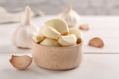 Fresh garlic on white wooden table, closeup