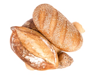 Loaves of different breads on white background, top view