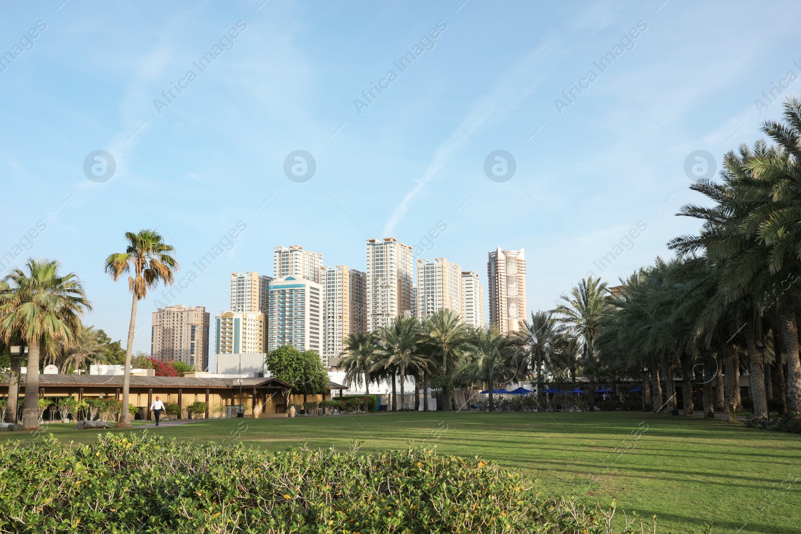 Photo of SHARJAH, UNITED ARAB EMIRATES - NOVEMBER 04, 2018: Beautiful landscape with tropical resort on sunny day