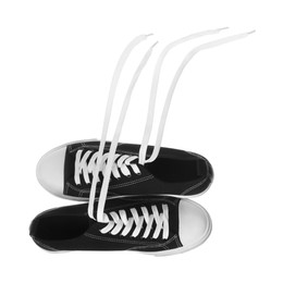 Photo of Pair of black classic old school sneakers isolated on white
