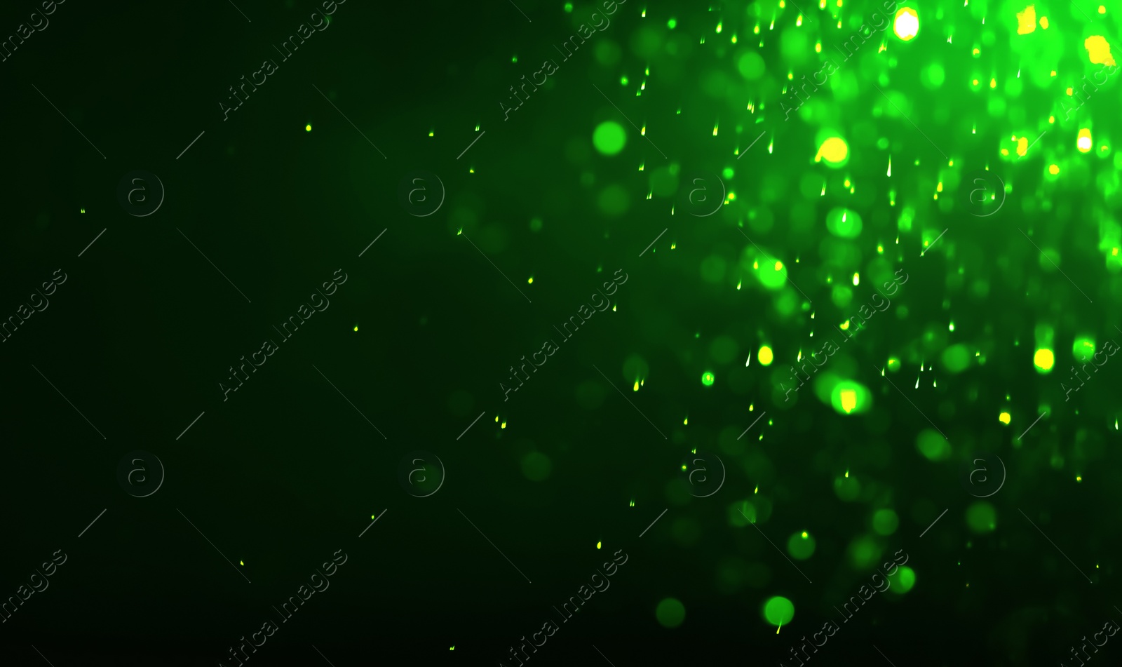 Image of St. Patrick day. Shiny green glitter on black background, bokeh effect