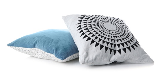 Soft decorative pillows on white background