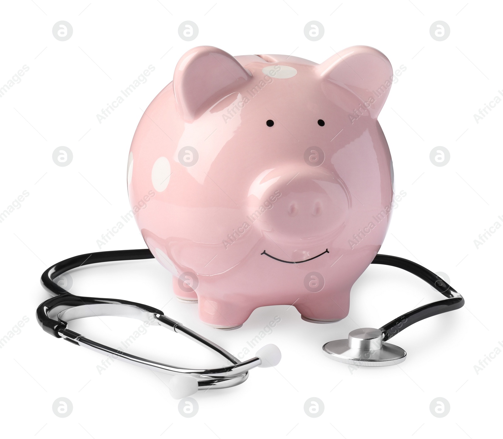 Photo of Piggy bank with stethoscope on white background. Medical insurance