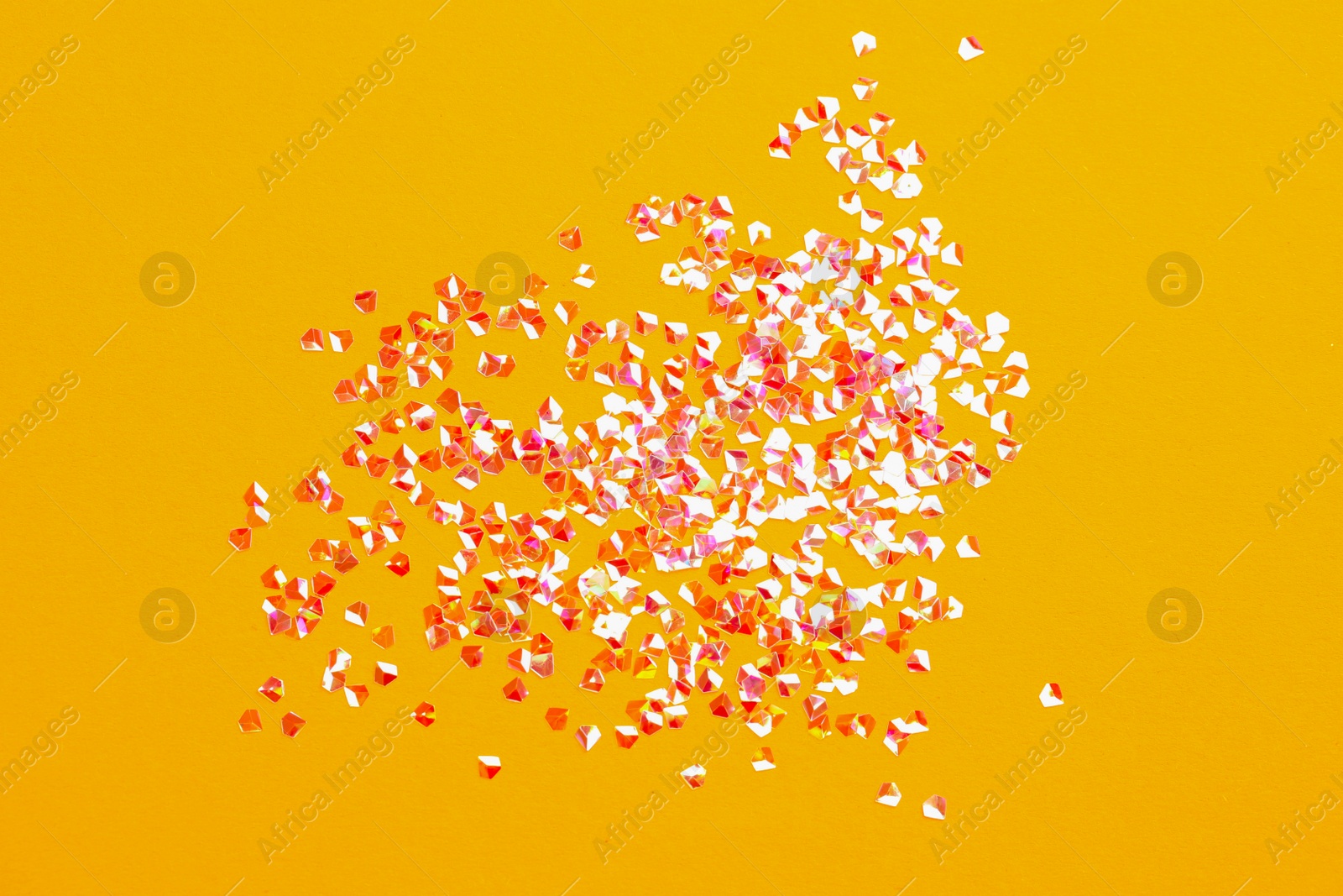 Photo of Pile of shiny glitter on orange background, flat lay