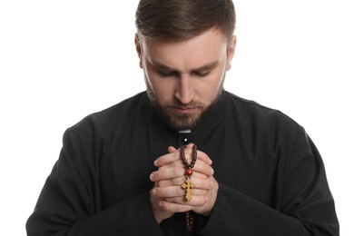 Photo of Priest with rosary beads praying on white background