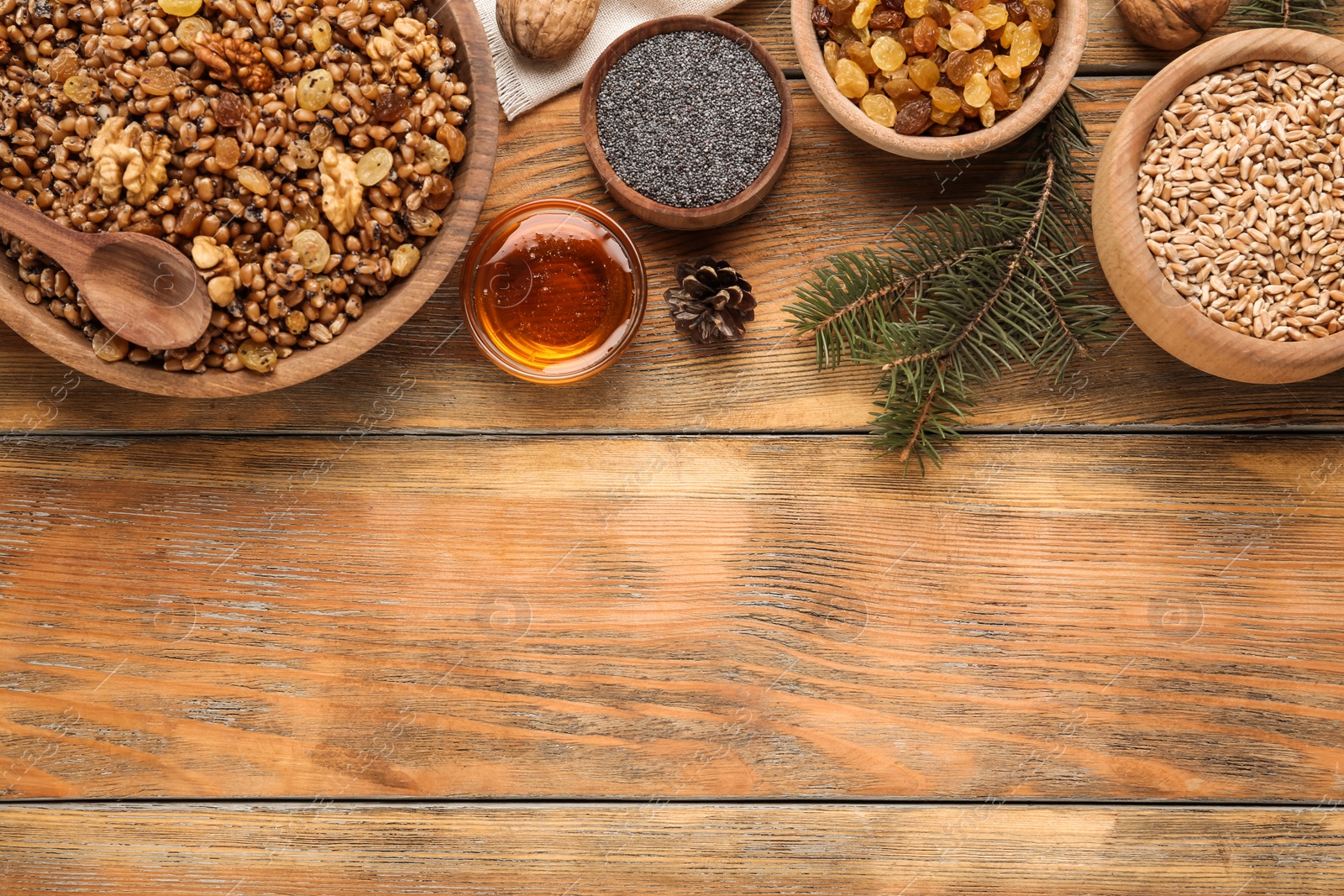 Photo of Traditional Christmas slavic dish kutia served on wooden table, flat lay. Space for text